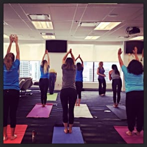 Photo of POF team doing yoga