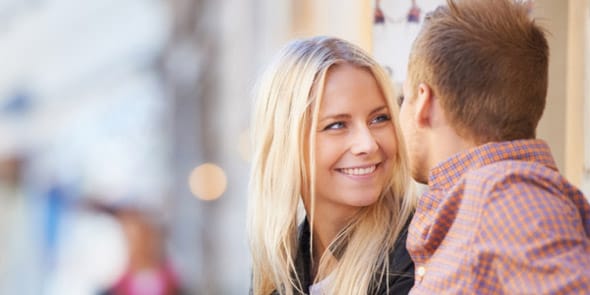 Photo of a man and woman having a two-way conversation Photo of a man and woman having a two-way conversation