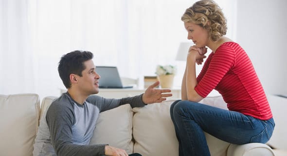 Photo of a couple engaging in conversation Photo of a couple engaging in conversation