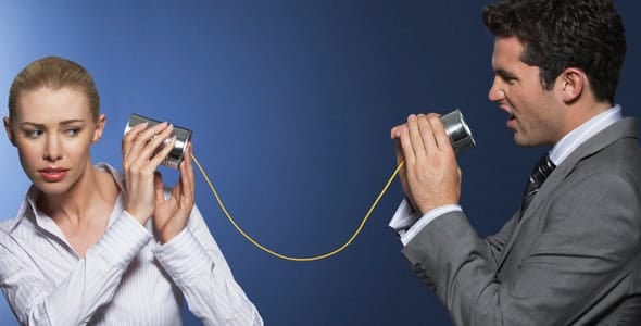 Photo of a man speaking while woman looks uncomfortable