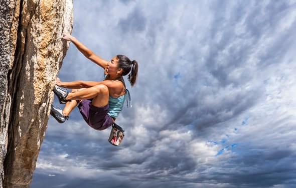 Photo of a girl rock climbing