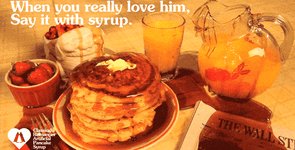 Pancakes getting poured with syrup