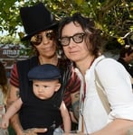 Photo of Sara Gilbert, Linda Perry, and their baby boy Rhodes