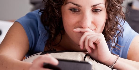 Photo of a girl texting on her phone Photo of a girl texting on her phone