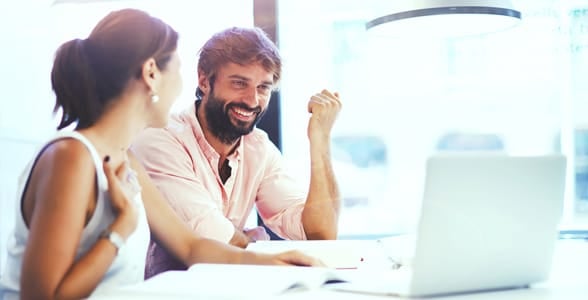Photo of a man and woman working together Photo of a man and woman working together
