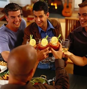 Photo of men toasting at a dinner