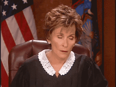 A GIF of Judge Judy shaking her head