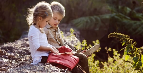 Photo of a brother and sister sitting together Photo of a brother and sister sitting together