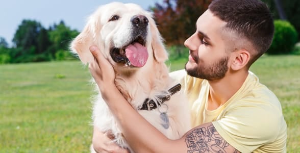 Photo of a guy with a dog Photo of a guy with a dog