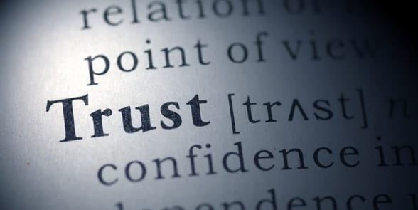 Photo of the word trust in a dictionary