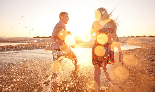 Photo of a happy couple on the beach Photo of a happy couple on the beach