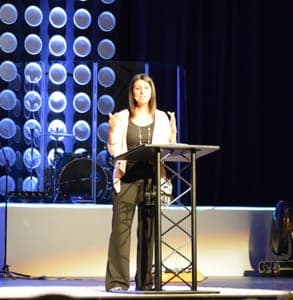 Photo of blogger Debra Fileta on stage at a speaking event Photo of blogger Debra Fileta on stage at a speaking event