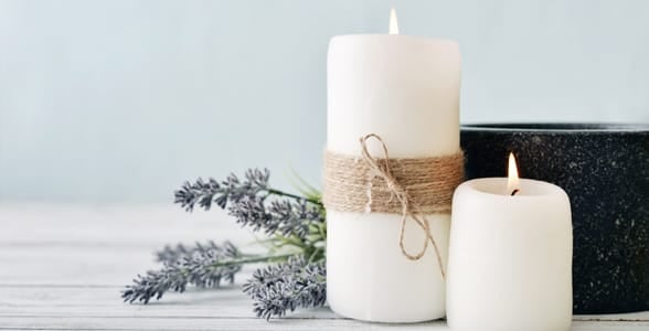 Photo of two candles and lavender