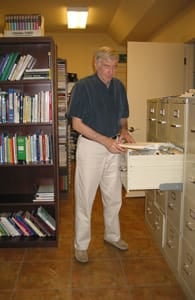 Photo of Stephen Barrett at a file cabinet