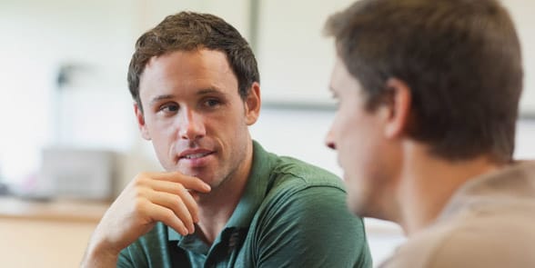 Photo of two men having a serious conversation