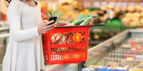 Photo of a woman grocery shopping Photo of a woman grocery shopping