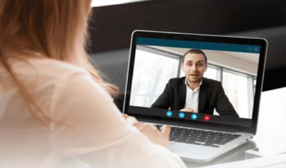 Photo of a JWed client and coach chatting on a laptop