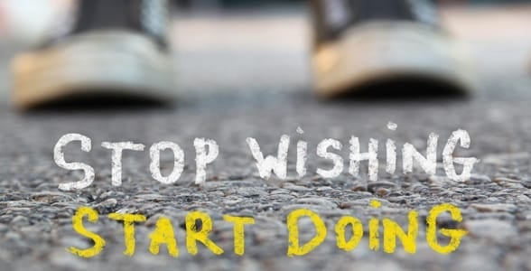 A motivational poster that says stop wishing, start doing