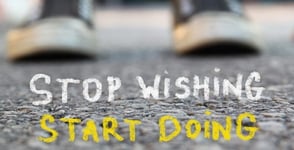 A motivational poster that says stop wishing, start doing
