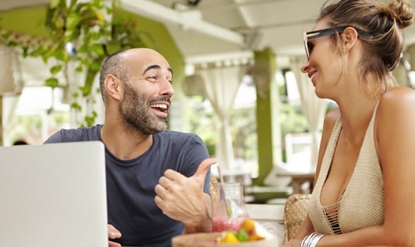 Photo of a man laughing at a woman