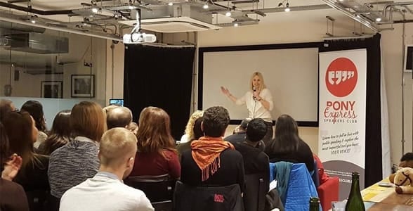 Photo of Olga Frankow at a speaking event