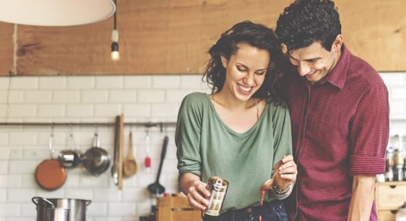 Photo of a couple cooking together