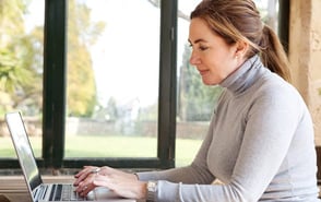 Photo of a woman on a laptop