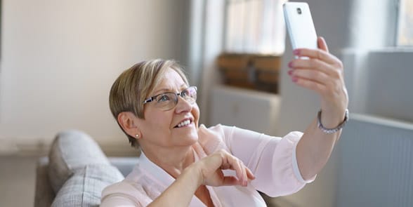 Photo of a woman taking a selfie