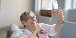 Photo of a woman taking a selfie