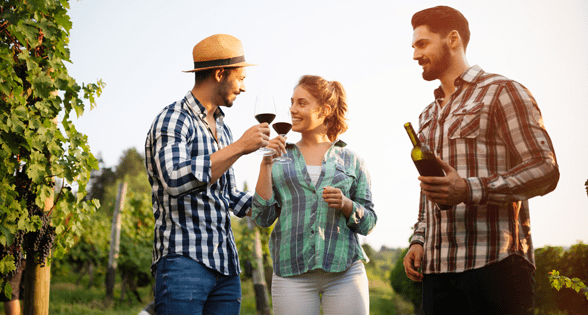 Photo of tour guests enjoying a bottle of wine