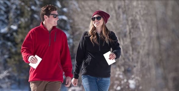 Photo of a couple wearing SCOTTeVEST jackets