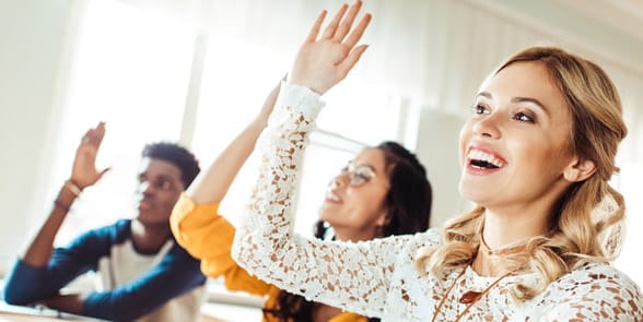 Photo of a woman raising her hand