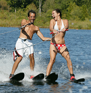 Photo of a couple water skiing at Club Getaway