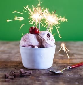 Photo of Three Twins ice cream with a candle in it