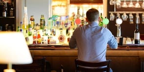 Photo of a man alone at a bar Photo of a man alone at a bar