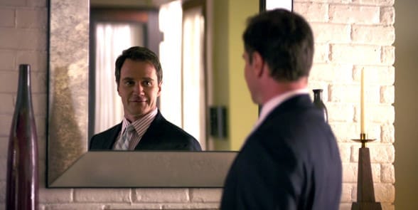 Photo of a man smiling in the mirror Photo of a man smiling in the mirror