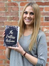 Photo of Annabelle Knight holding her book, The Endless Autumn