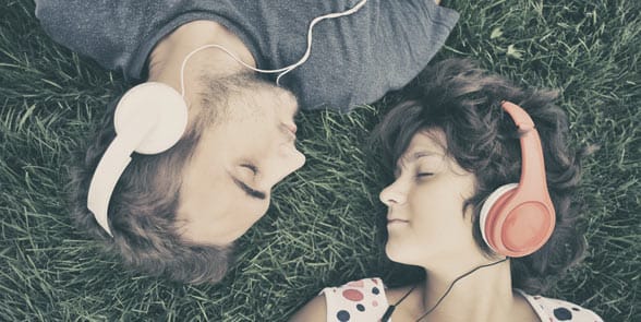 Photo of a couple listening to music