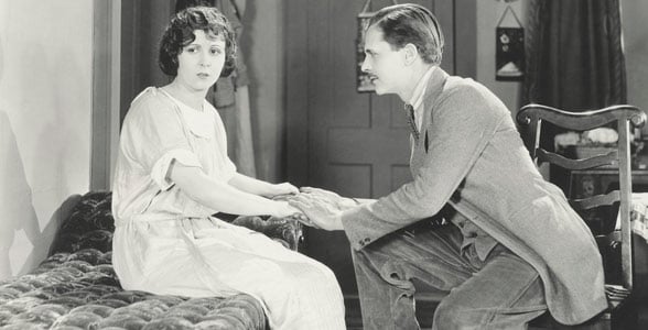 Photo of a man asking out a woman