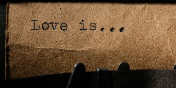 Photo of a typewriter with love is on it