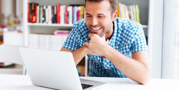 Photo of a man on a laptop