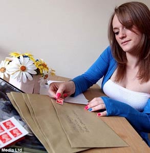 Photo of Jen Johnson sending a letter to her husband in the military