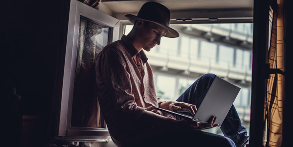 Photo of a man on a laptop