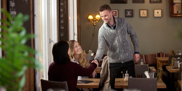 Photo of a woman introducing himself to someone