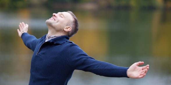 Photo of a man with his arms out