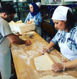 Photo of Syrian women cooking at Newcomer Kitchen
