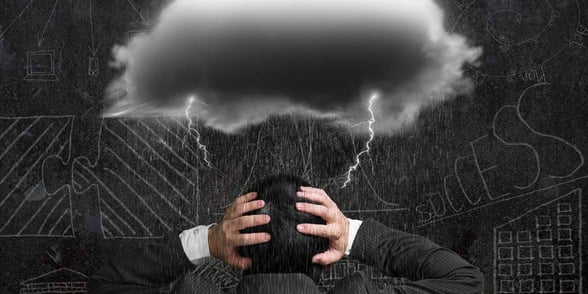Photo of a storm cloud over a man's head Photo of a storm cloud over a man's head