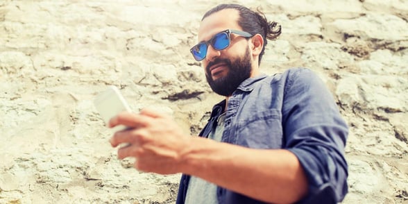 Photo of a man texting Photo of a man texting