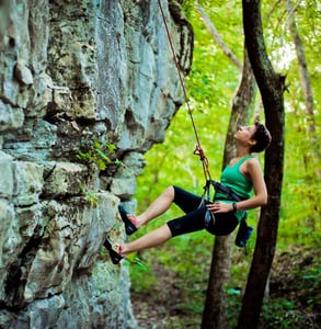 Photo of a woman rockclimbing at Monte Sano Park