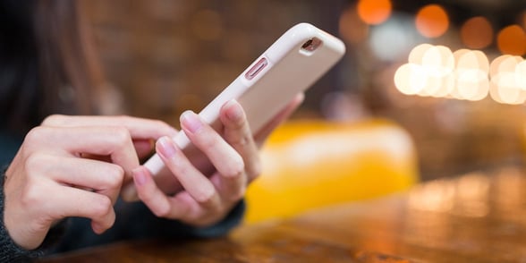 Photo of a woman texting